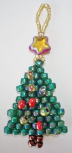 beaded green christmas tree with a red star bead on the top, made by Amanda Crago of Bowerbird Jewellery