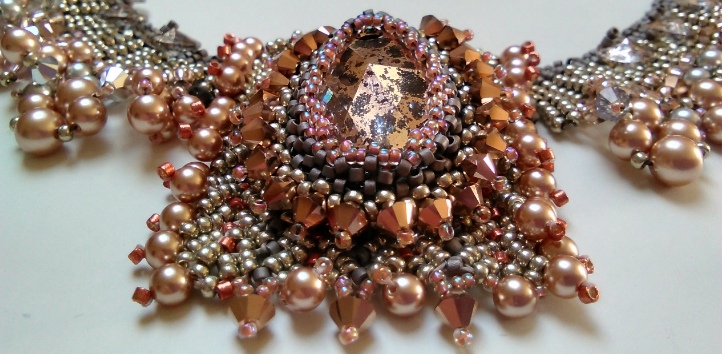 Beaded necklace collar using Swarovski glass pearls, bicone crystals and a large drop shaped crystal