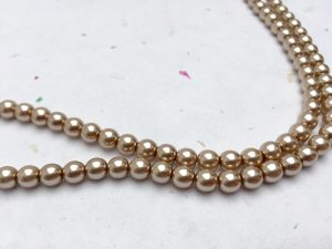 String of glass pearls in a deep cream colour