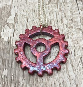 Steampunk cog pendant in red and lilac