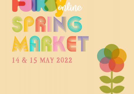 Image of the Folksy Spring market 14-15 May using Folksy's brand colours of green, yellow, russet orange, pink, purple and blue, with a flower using these colours on a light pink background